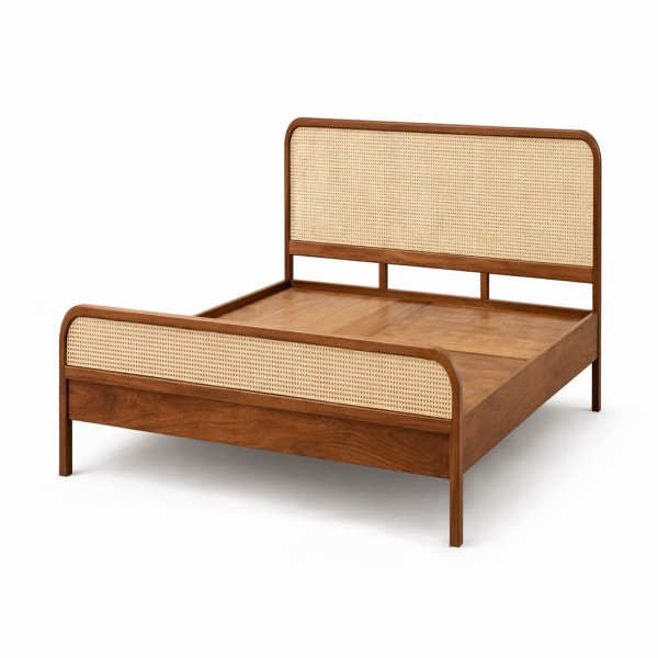 Wooden bed with woven cane panels